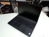 a laptop that is sitting on a table in a room