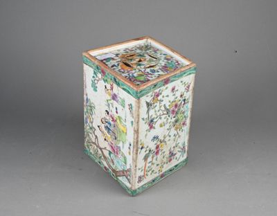 a white and green box with flowers and birds on it