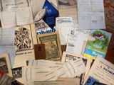 a pile of old books and pamphlets on a table