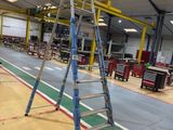 a ladder that is sitting on the floor in a building