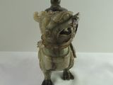 statue of a turtle with a bird on its back