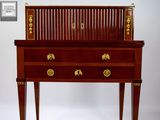 a small wooden desk with a drawer on top of it