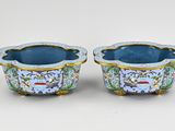 pair of blue and gold vases with birds and flowers on them
