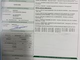 a picture of a receipt on a desk with a pen