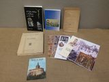 several books are sitting on a table next to each other