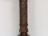 an image of a tall wooden pedestal with a clock on top of it