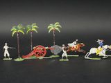 toy figurines of a man riding a horse and a cart with a man on it