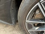 a close up of a tire on a car ' s rim