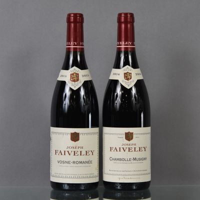 two bottles of wine sitting on top of a glass table
