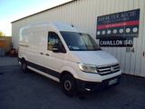 the white van is parked in front of a building