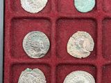 a box of silver coins that are in a red case