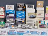 a lot of toy cars and boxes on the table
