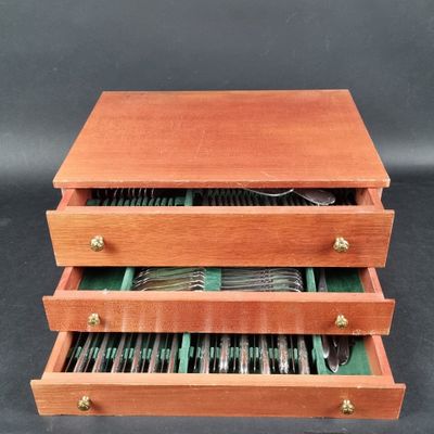 an image of a wooden box with silverware inside of it
