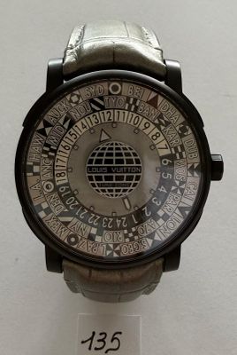 a watch that is on display on a white surface