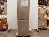 a refrigerator that is sitting in the middle of a warehouse