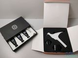 a box that has a bottle opener and a bottle opener in it