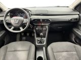 the interior of a car with a steering wheel, dashboard, and dashboard controls
