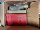a box full of books sitting on top of a table