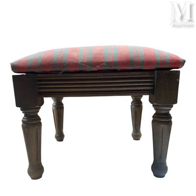 a small bench with a red and blue cushion on it