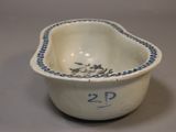 a small bowl with a blue and white design on it