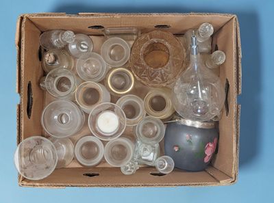 a box full of empty glassware on a blue surface