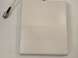 the antenna is attached to a white box on a white surface