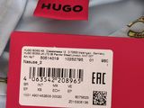 the back of a shirt with a tag on it that says hugo