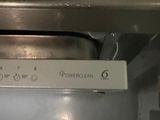 a close up of a microwave with a sign on it