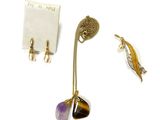 three pieces of jewelry including a necklace, earrings, and a broochet