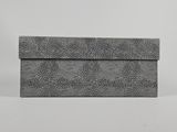 a grey snake skin clutch bag on a white background