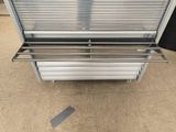 an image of a metal bench on a tiled floor