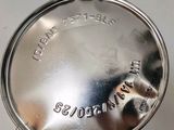 an image of a silver plate with writing on it sitting on a table