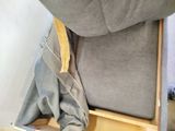 a cat that is sitting on a chair in the room