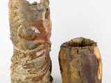 two vases that are sitting next to each other