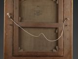 an old wooden easel with a painting on top of it