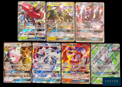 several pokemon cards are lined up on a black surface