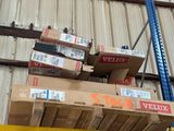 many boxes stacked on a pallet in a warehouse