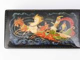wallet with a picture of a woman riding on a sleigh with reindeers