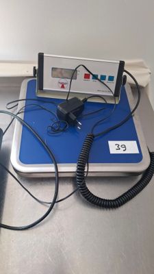 a laptop computer sitting on top of a blue and white table