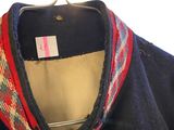 an image of a jacket hanging on a hanger