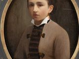 portrait of a young boy in a brown jacket and black and white striped shirt