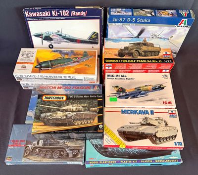many different models of military vehicles on the table