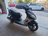 a scooter that is parked in a garage