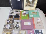a lot of books on a table with pictures on them