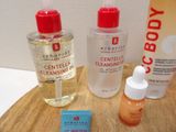 a bottle of lotion and a bottle of lotion sitting on a table