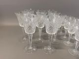 a lot of wine glasses that are sitting on a table