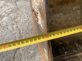 a measuring tape that is on the side of a piece of metal