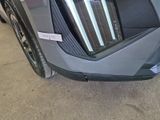 a close up of a car door with a sticker on it