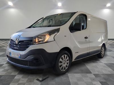 the white van is parked on a checkered floor in a room