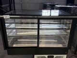 an image of a refrigerated display case in a warehouse